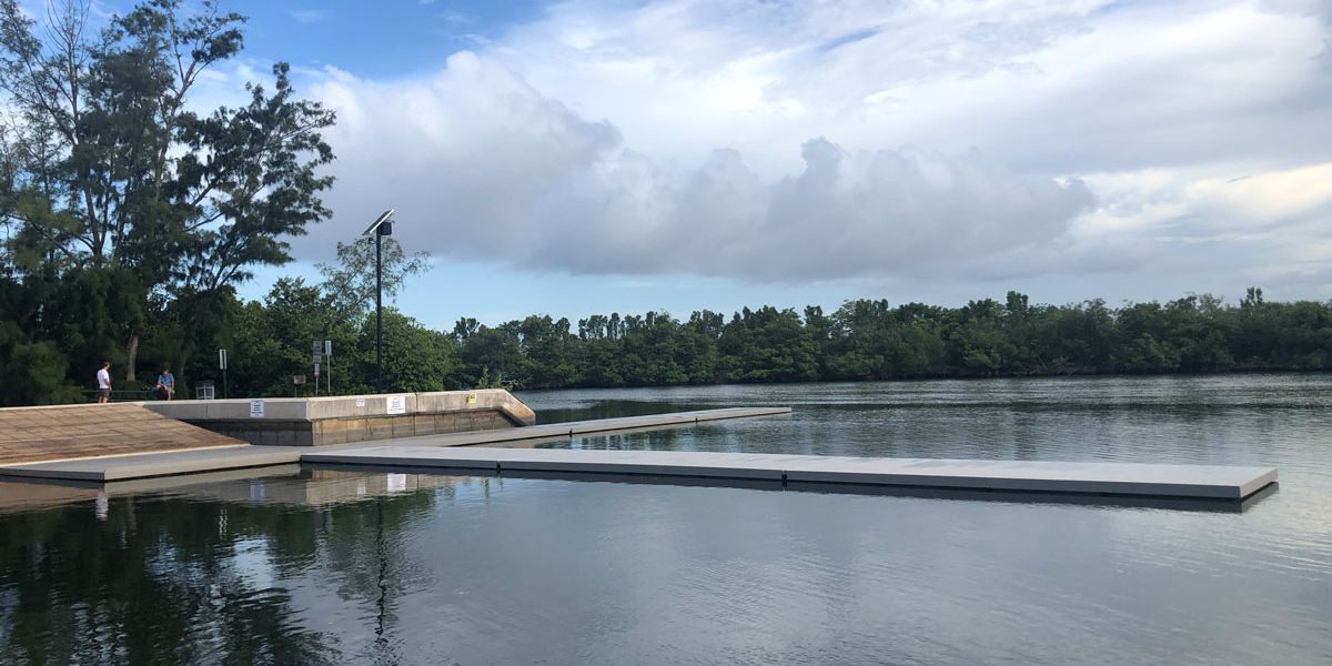 A floating dock that improves rowing program performance for facilities.