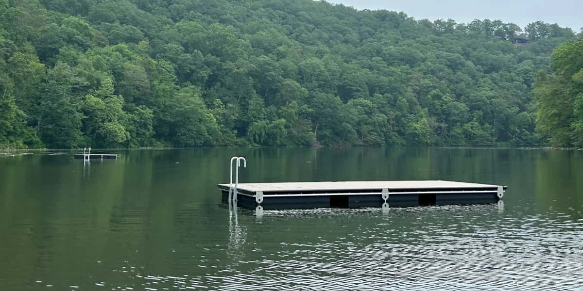 floating swim platform anchored on calm lake illustrating dock anchors for stability and alignment