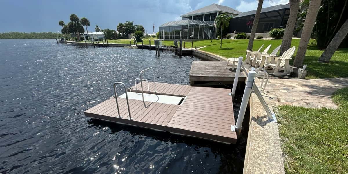 Residential waterfront with floating kayak launch featuring assist rails and low-profile design for safe, stable water entry.
