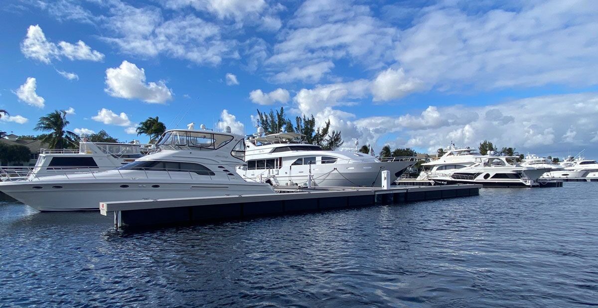 Yachts docked for people living on a boat in a marina.