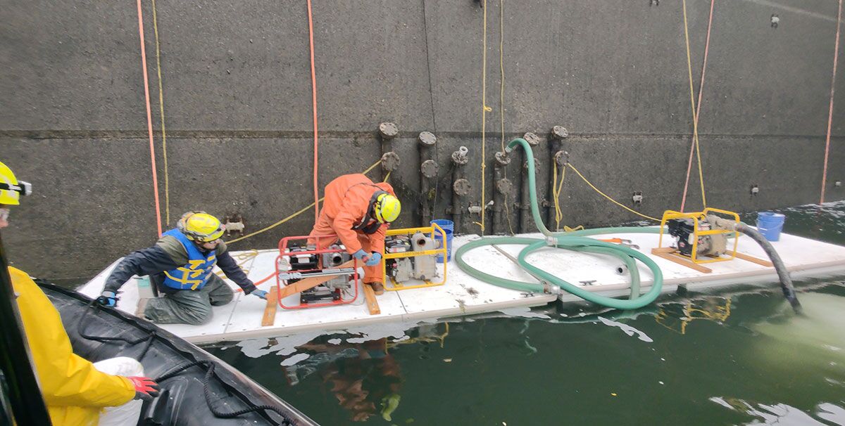 Labor workers aboard AccuDock's temporary floating docks while on a water-based job.