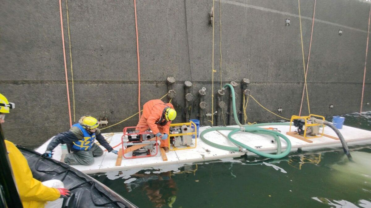 Workers standing on Floating Work Platforms.