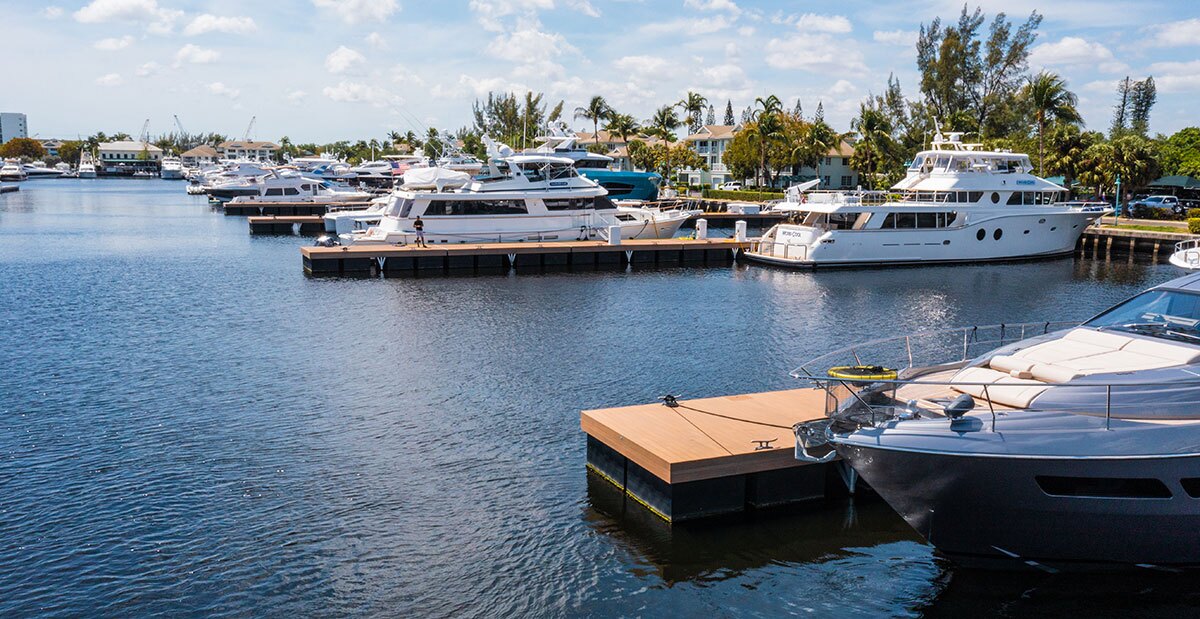 A floating dock on the intercoastal waterway showing a boat tied to essential dock accessories: dock cleats.