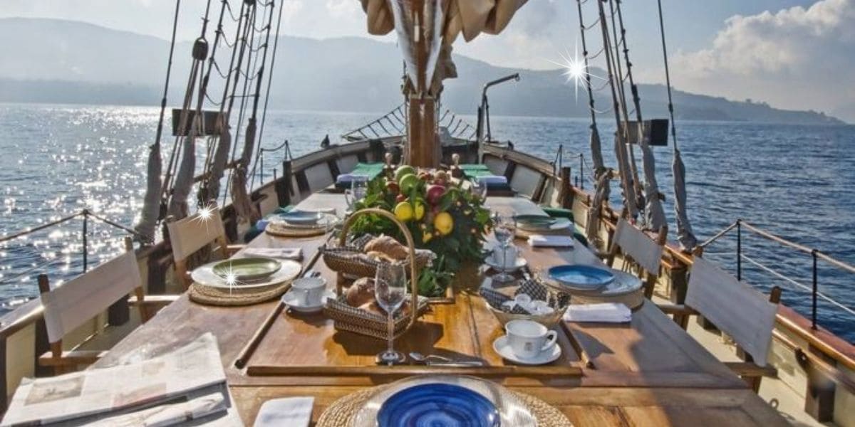 Beautiful Thanksgiving boat dining setup with a festive table, surrounded by calm waters and scenic views.