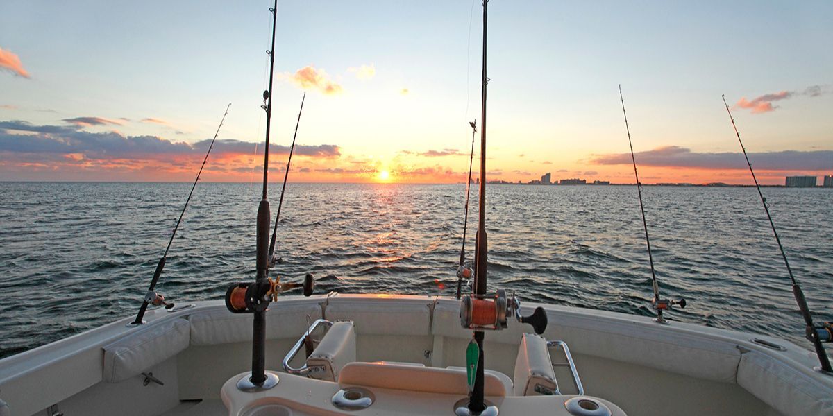 A charter boat returning to shore to cook fish caught on gulf coast.