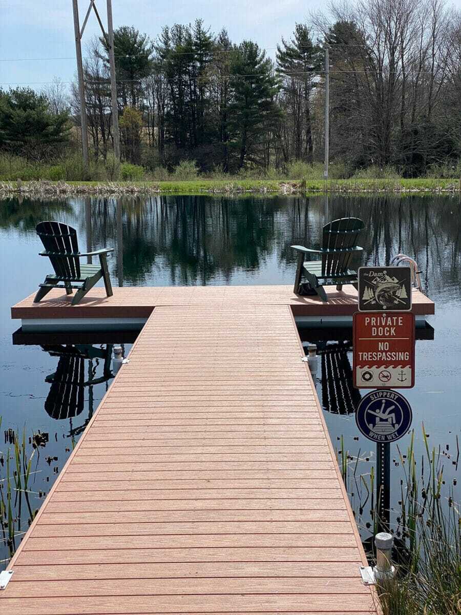 Leisure Dock with chairs for people to sit outside and watch the water