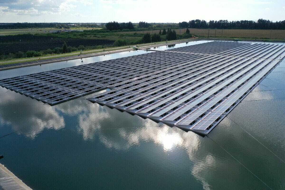 floating dock solar panels on a large body of water