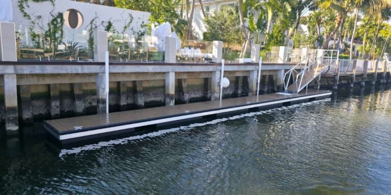 waterfront floating dock with synthetic surface showing best decking for docks in a coastal residential setting