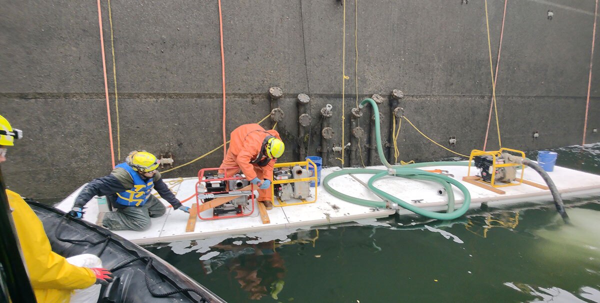 Labor workers aboard AccuDock's temporary floating docks while on a water-based job.