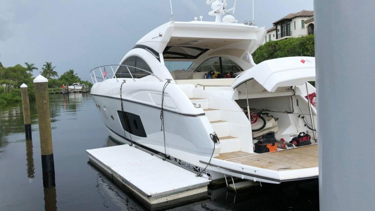 Floating Work Dock next to a large white boat.