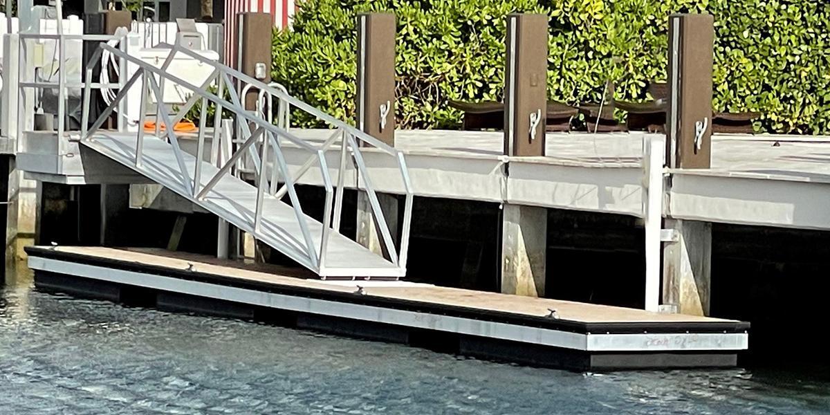 A private floating dock by AccuDock built in compliance with boat dock rules and regulations.